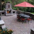A Patio with a Grill Island, Seat Walls and Fireplace