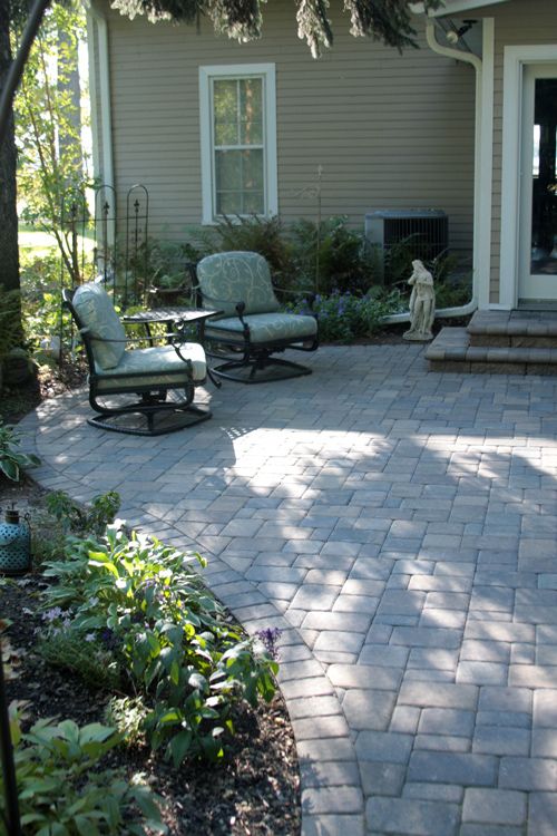 Pavers and a simple design turned this backyard into a shaded patio.