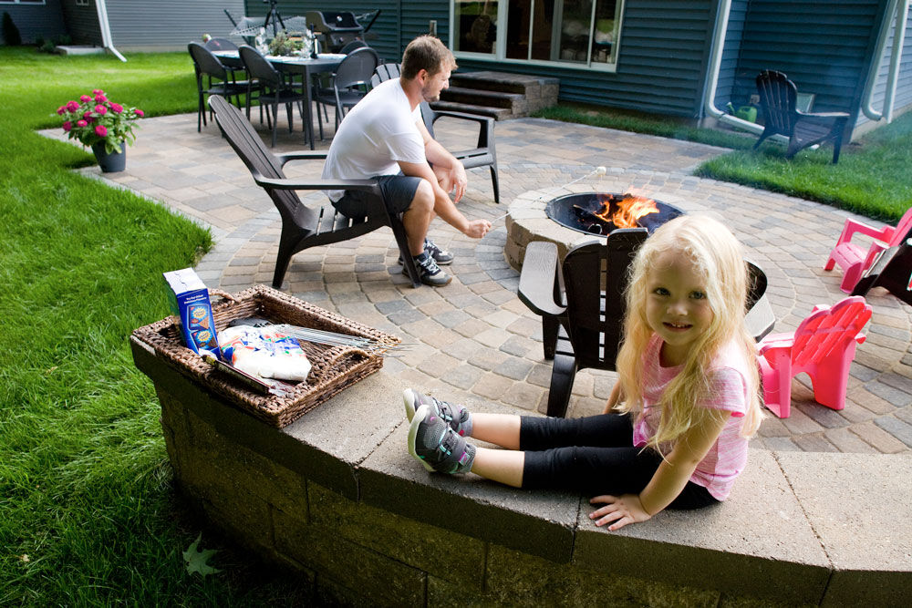 The fire pit and patio area are the family's favorite place to gather instead of a deck in the back yard.