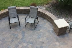 A paver patio and seat wall create a perfect outdoor living space design.