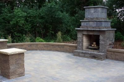 Plymouth residence with outdoor fireplace and patio living space.