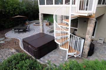 The new spiral stairs and paver patio made the perfect pad for the hot tub, dining area and fire pit.