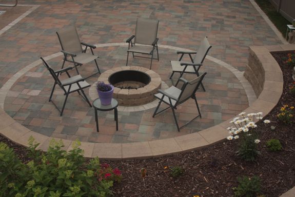 Seating around the cozy fire pit will keep you outside longer.