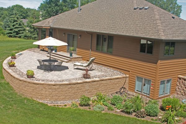 This raised paver patio is made possible with a VERSA-LOK retaining wall foundation.