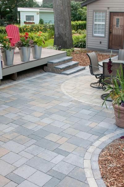 This paver patio has space for cooking, dining and relaxing outdoors.
