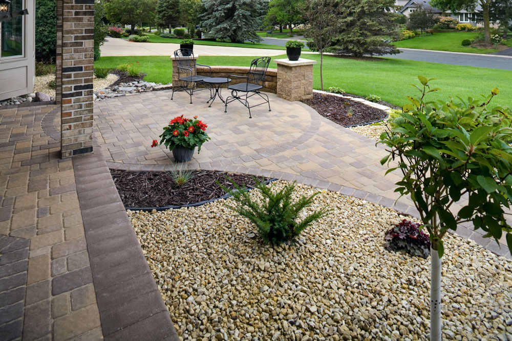 The home's front entrance paver patio serves as a wonderful gathering spot.