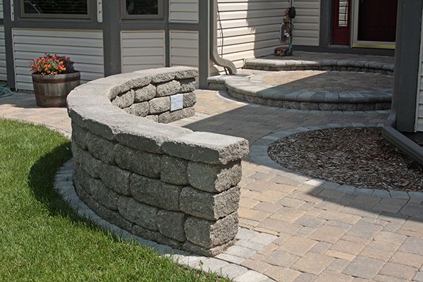 The home's front entrance includes several hardscaping features.