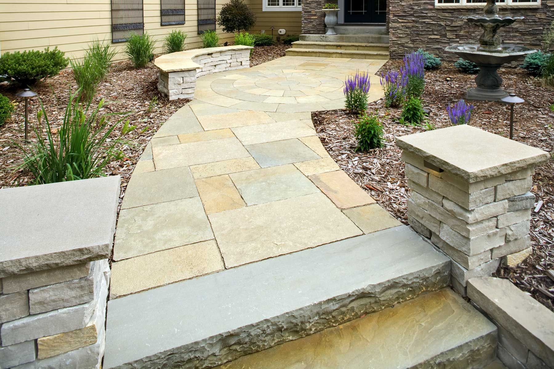 Natural Flagstone creates a stunning front entrance to this home.