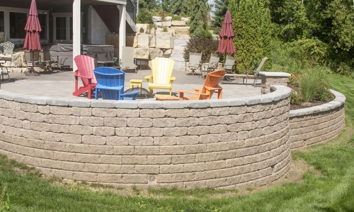 This stunning project designed by Villa Landscapes illustrates how hardscape products such as natural stone, retaining wall units and interlocking pavers combine artfully to create a backyard paradise.