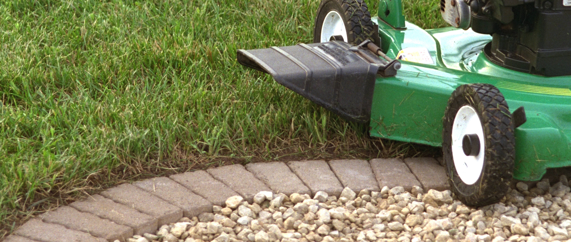 Add a row of pavers around a planting area for easy mowing without having to trim